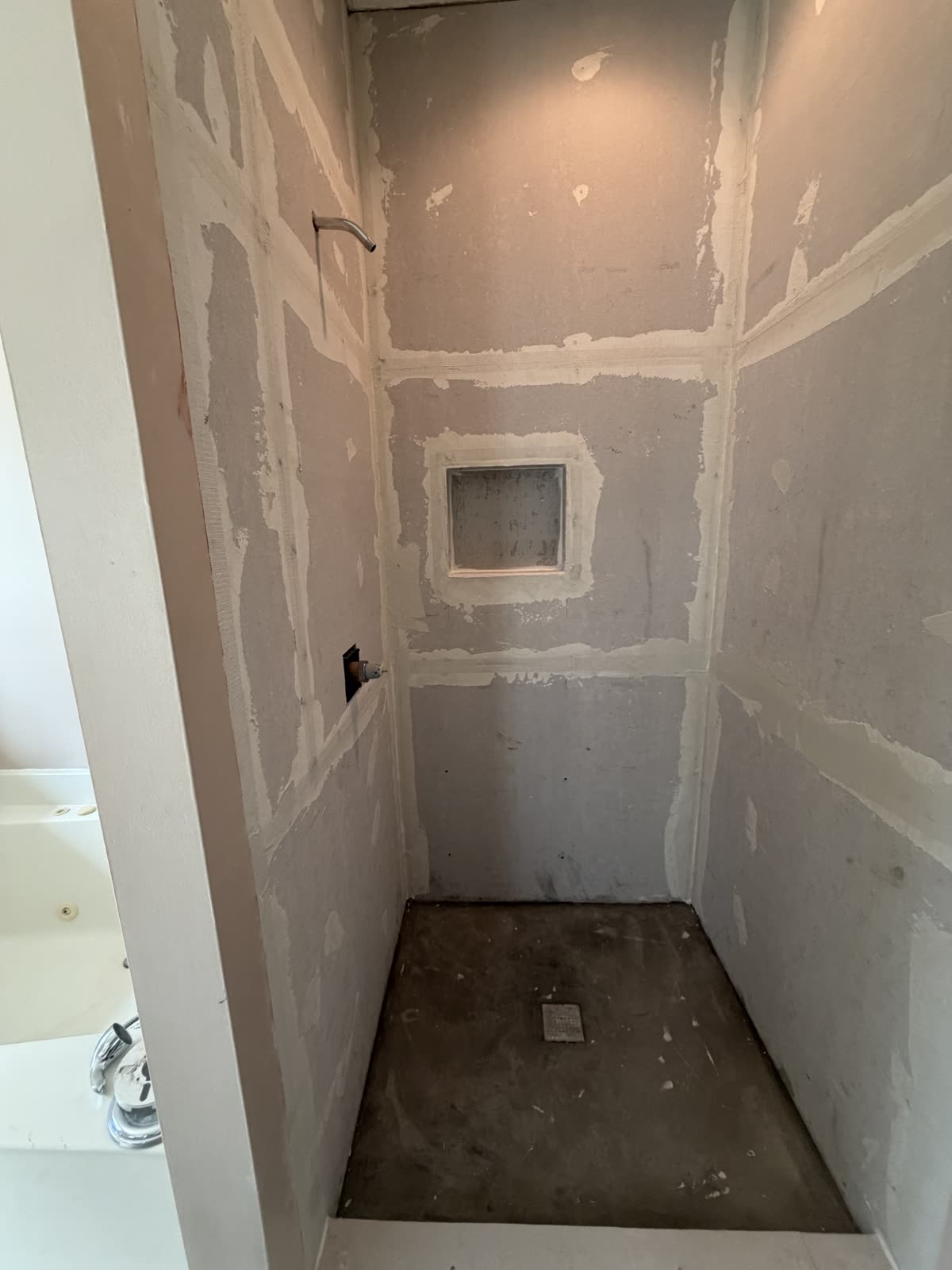 Shower area under renovation by Caballero C&L Remodeling