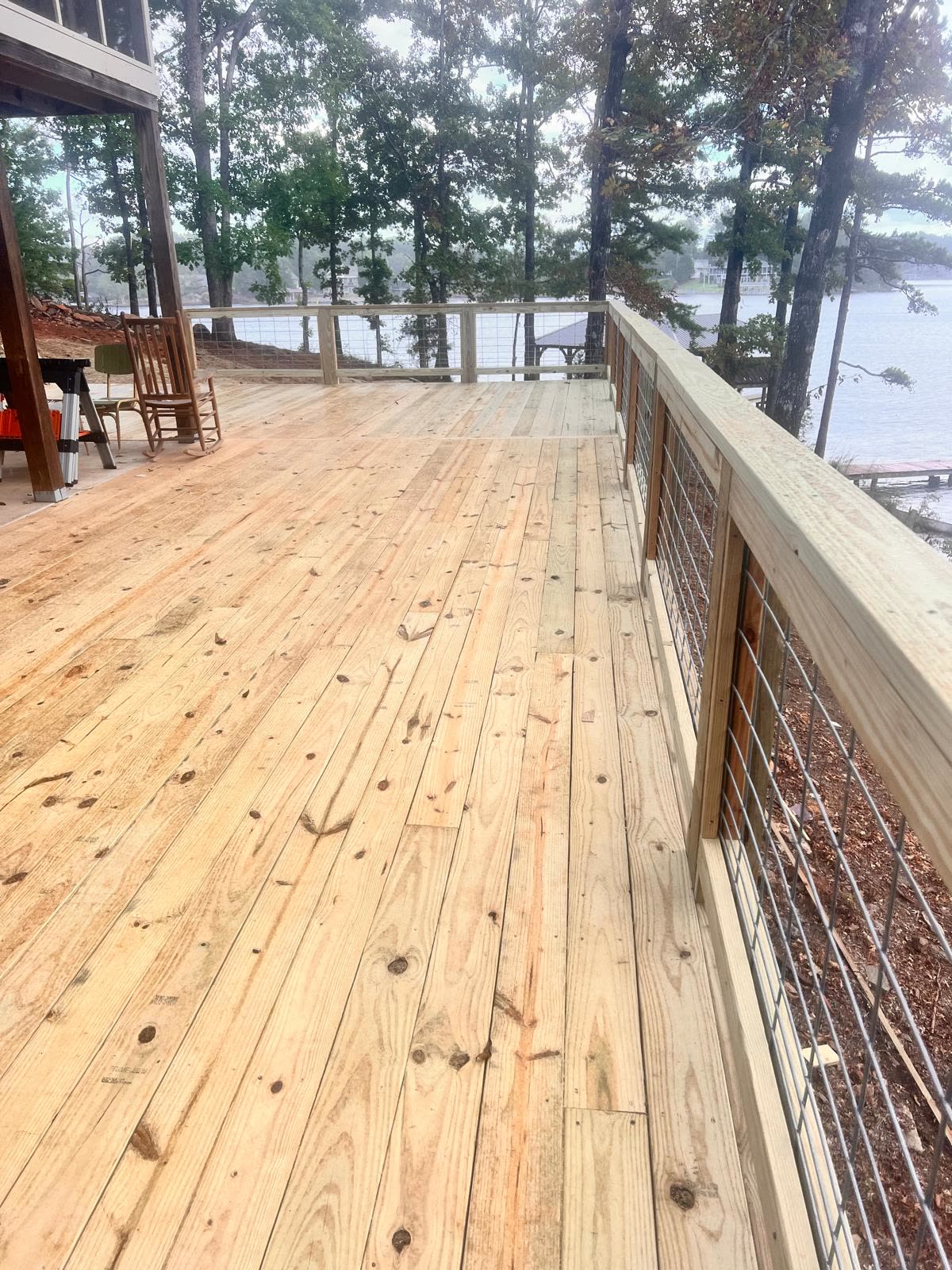 Spacious wooden deck with scenic lake view