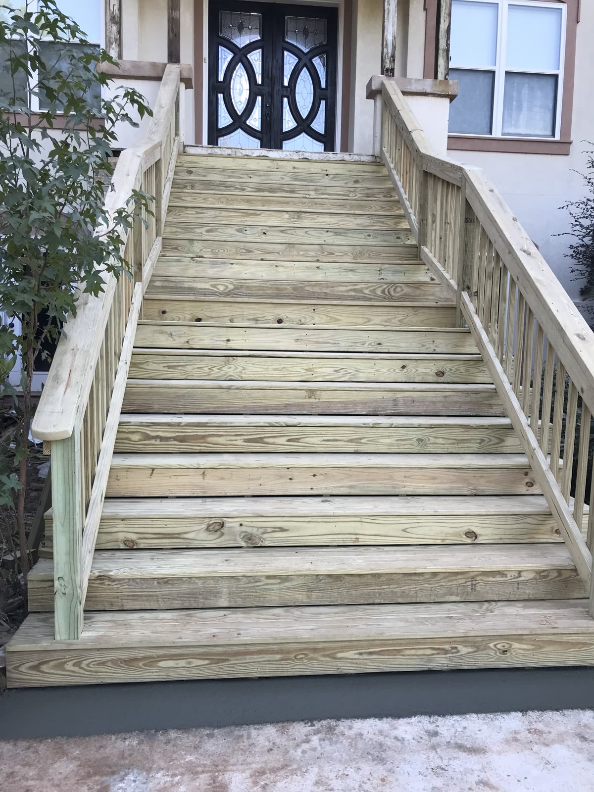 Wooden deck construction with wire railing