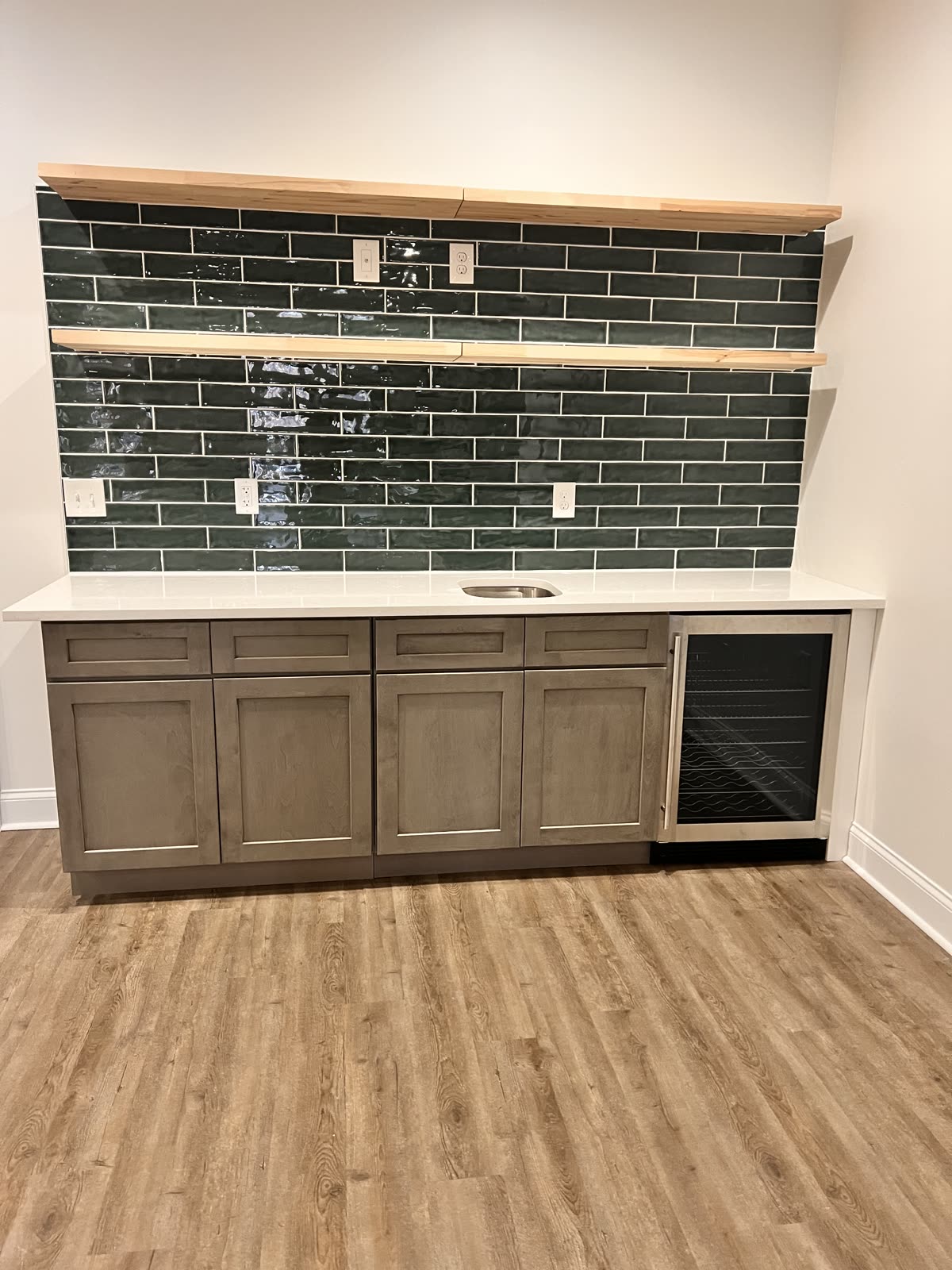 Custom kitchen remodel with green tile backsplash by Caballero C&L Remodeling