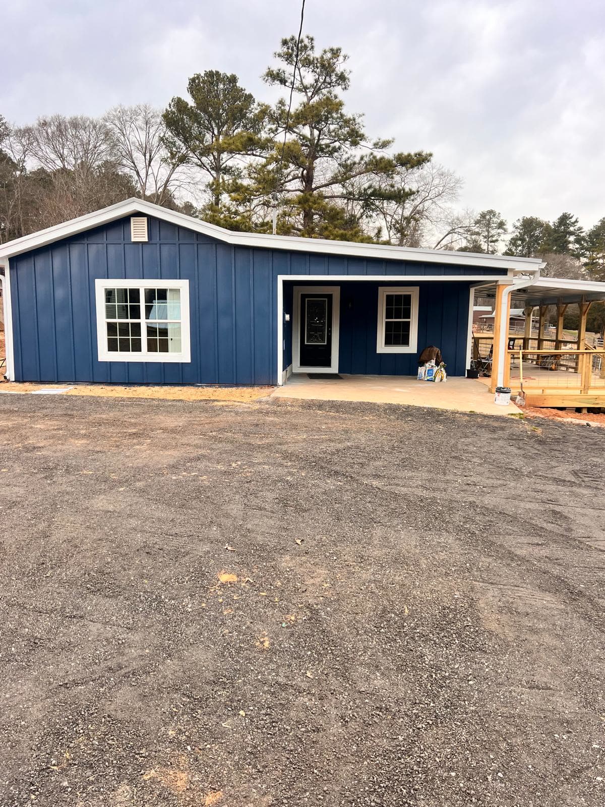 Home exterior siding project in blue paneling by Caballero C&L Remodeling